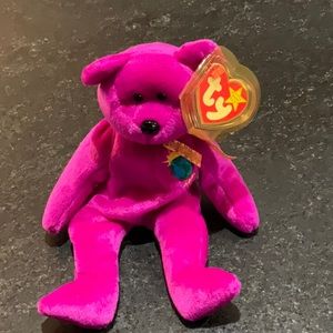 - TY BABY MILLENIUM BEAR WITH PROTECTIVE TAG HOLDER.